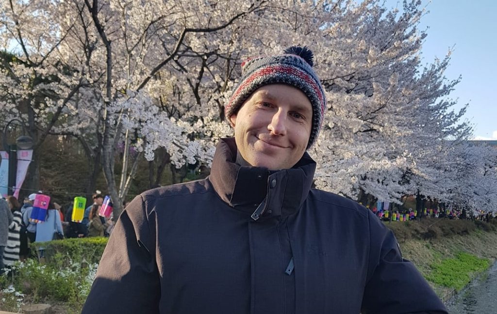 Joel with cherry blossoms at Seokcheon Lake, Seoul, South Korea