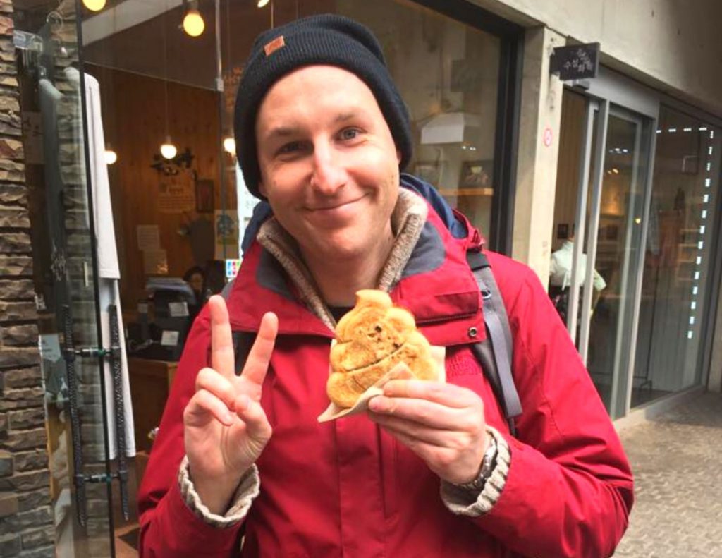 Joel with poop bread in Seoul, Korea